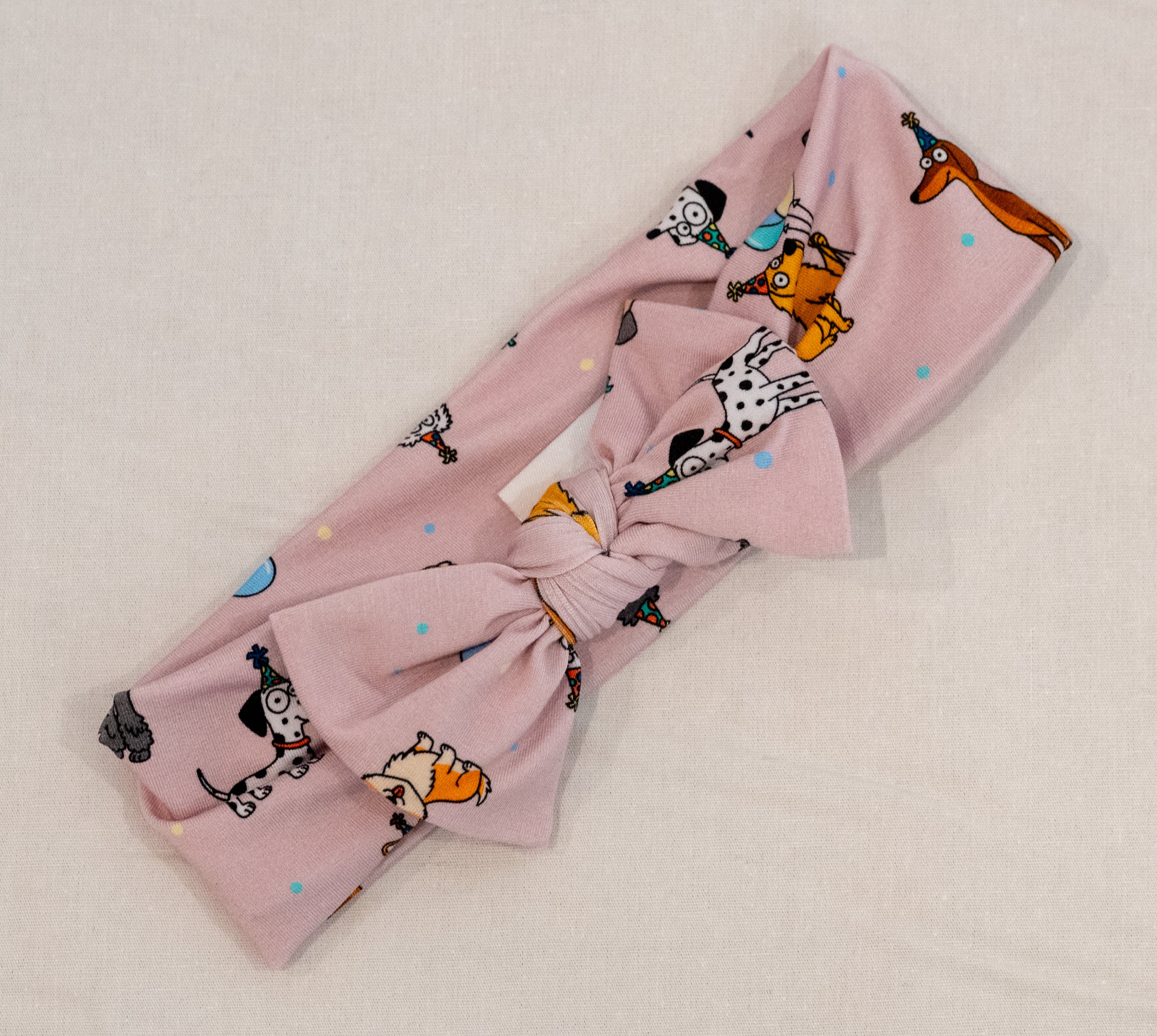 Pink bamboo bow head band for babies and toddlers dog puppy print