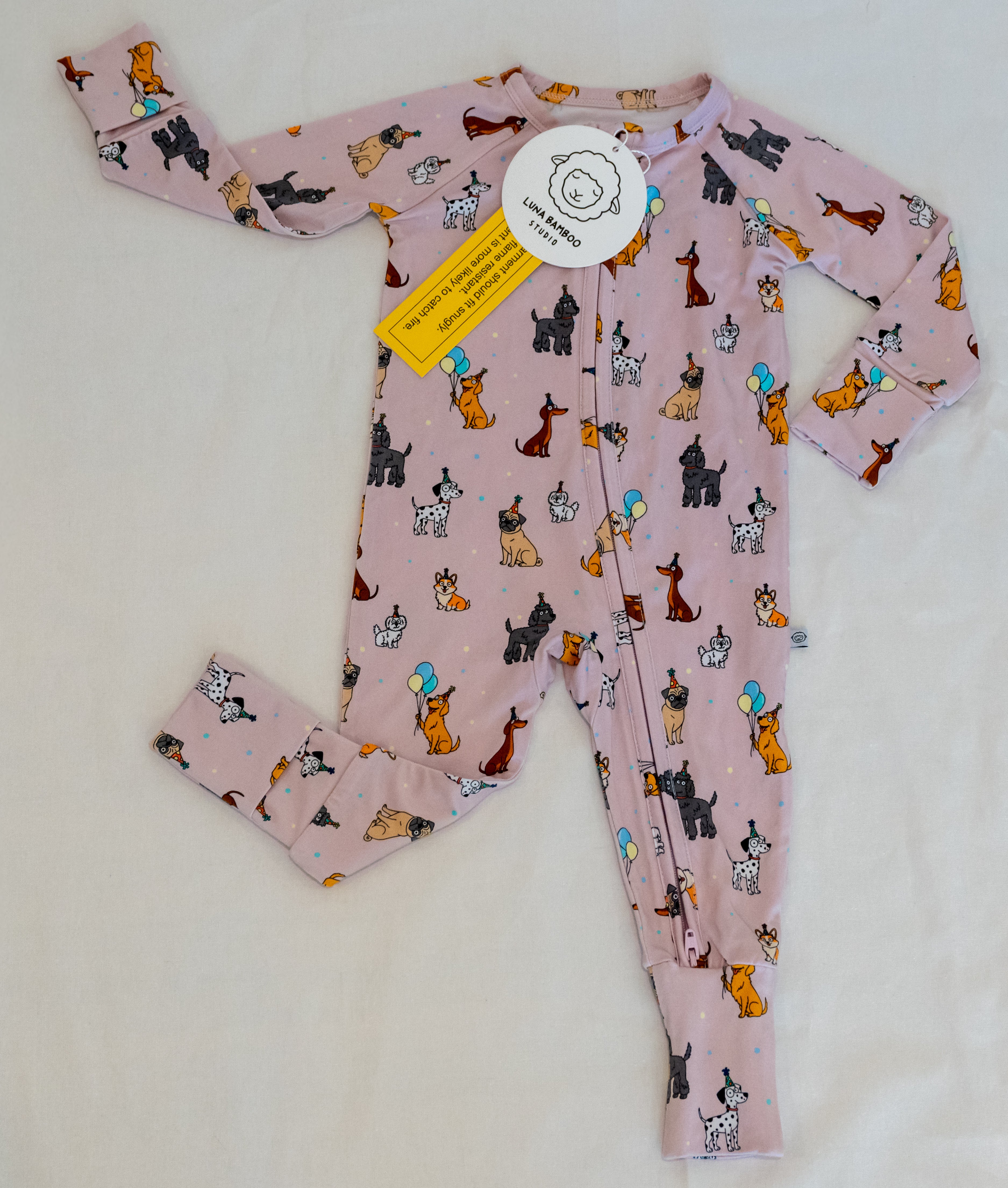 Pink bamboo zip sleeper with puppy print for babies & toddlers